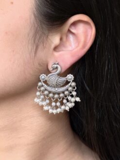 Silver plated bird design earrings with pearl detailing