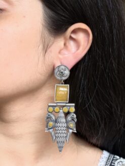 Oxidized silver replica peacock dangler earrings with stone work