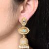 Gold plated jhumka dangler earrings with stone and pearl work