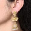 Gold plated jhumka dangler earrings with stone and pearl work