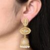 Gold plated jhumka dangler earrings with stone and pearl work