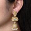 Gold plated jhumka dangler earrings with stone and pearl work
