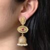 Gold plated jhumka dangler earrings with stone and pearl work
