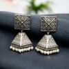 Oxidized silver replica jhumka earrings with floral art and pearl detailing