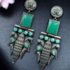 Oxidized silver replica peacock dangler earrings with stone work
