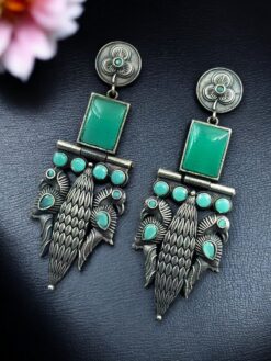 Oxidized silver replica peacock dangler earrings with stone work