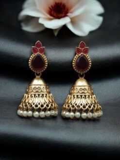 Luxurious gold plated jhumka earrings with sparkling stone embellishments and elegant pearl work, traditional Indian ethnic jewelry
