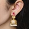 Gold plated jhumka dangler earrings with stone and pearl work