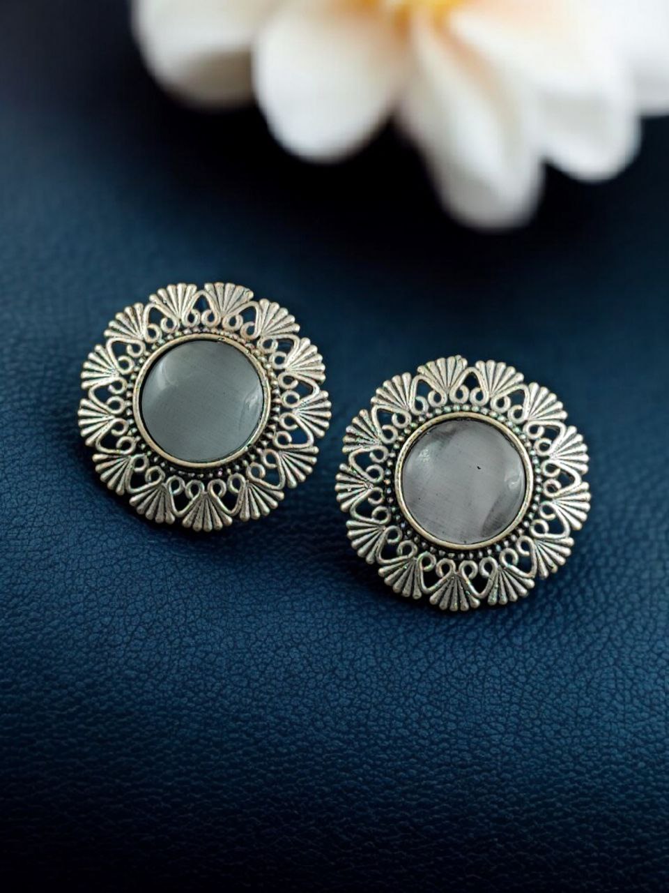 Antique Inspired Silver Replica Floral Art Statement Stud Earrings 3 Antique inspired silver replica floral art statement stud earrings with intricate carved detailing and oxidized finish for traditional and festive wear.