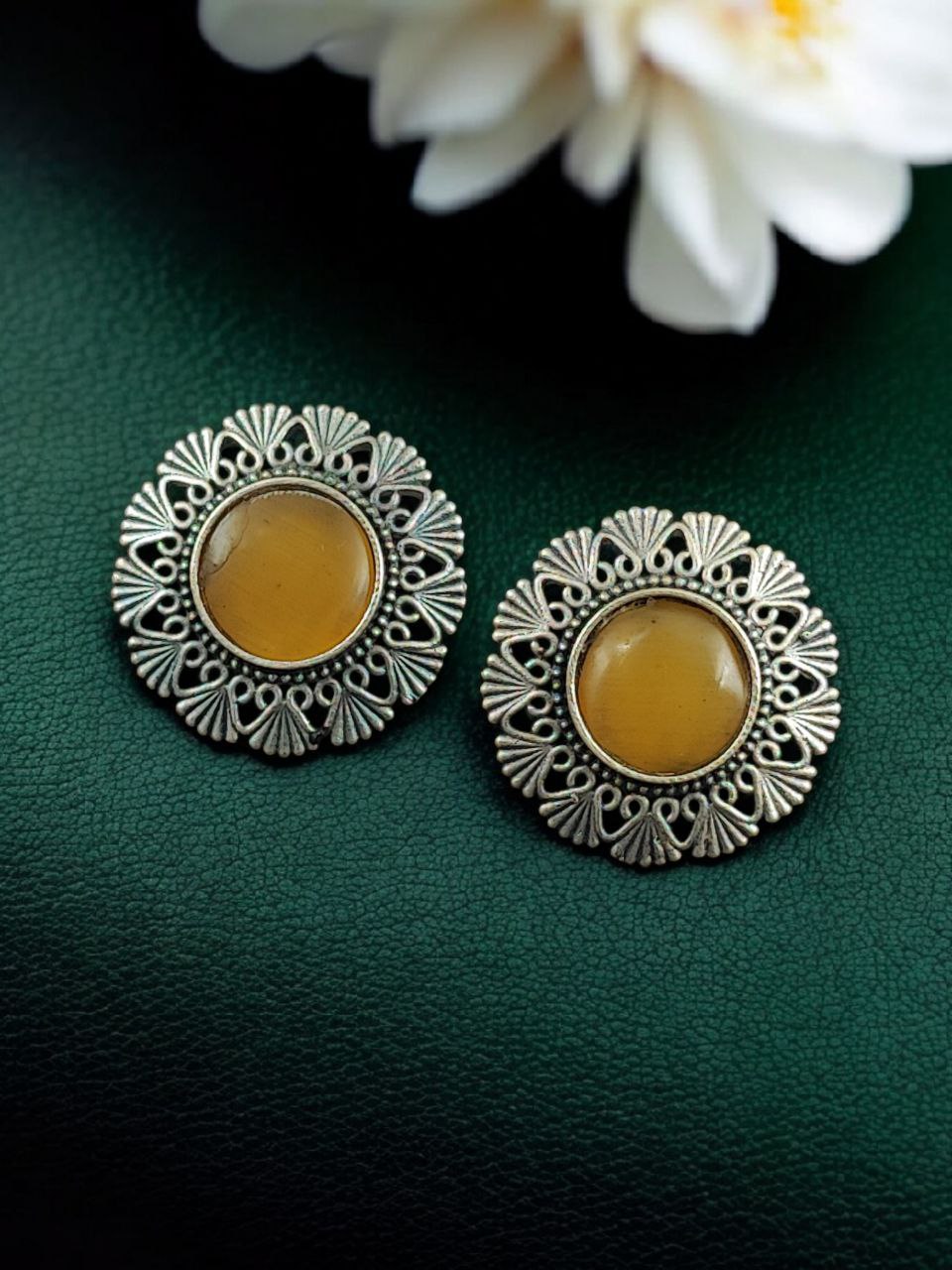 Antique Inspired Silver Replica Floral Art Statement Stud Earrings 6 Antique inspired silver replica floral art statement stud earrings with intricate carved detailing and oxidized finish for traditional and festive wear.