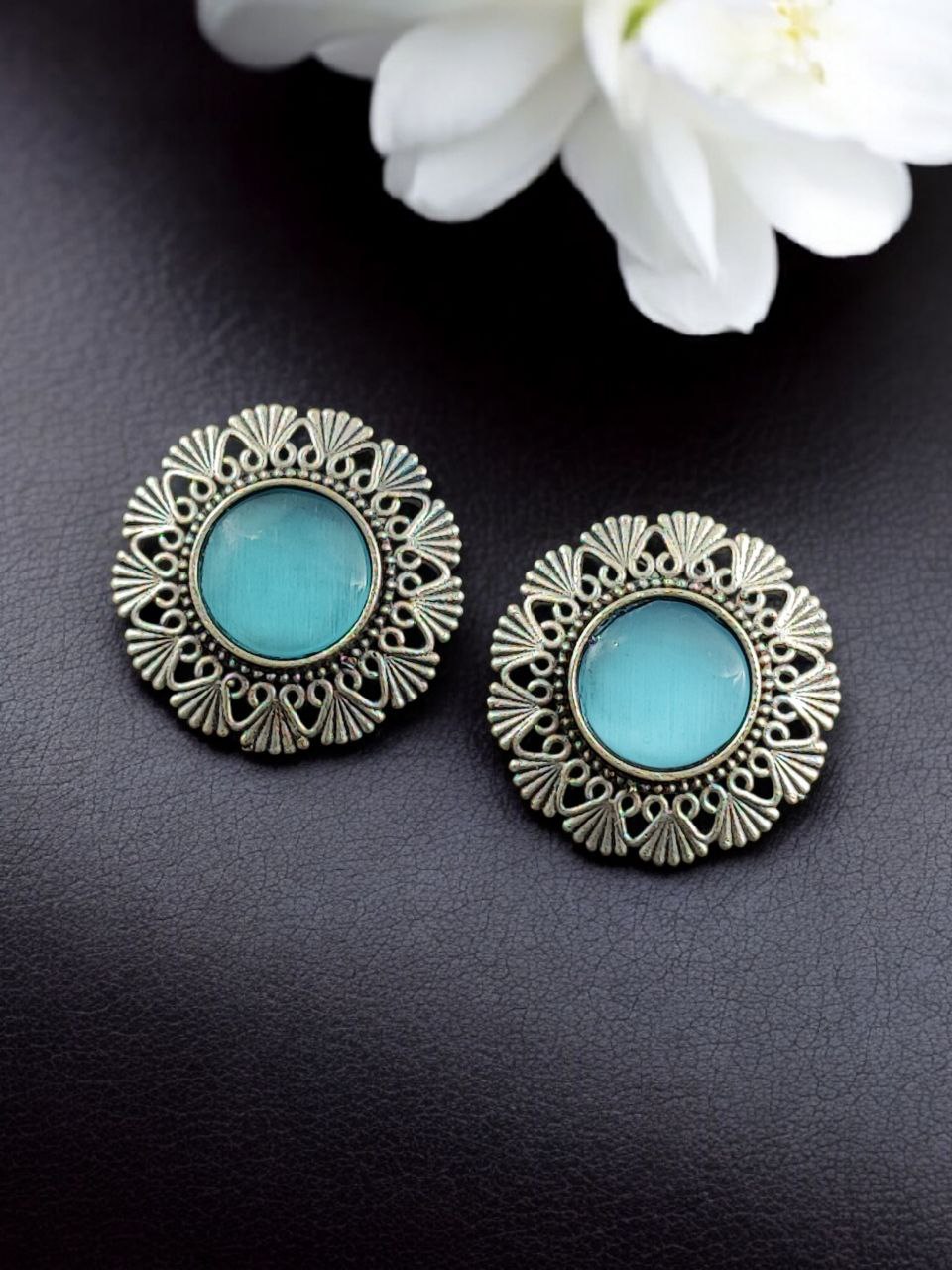 Antique Inspired Silver Replica Floral Art Statement Stud Earrings 8 Antique inspired silver replica floral art statement stud earrings with intricate carved detailing and oxidized finish for traditional and festive wear.