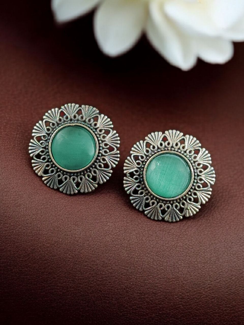 Antique Inspired Silver Replica Floral Art Statement Stud Earrings 7 Antique inspired silver replica floral art statement stud earrings with intricate carved detailing and oxidized finish for traditional and festive wear.