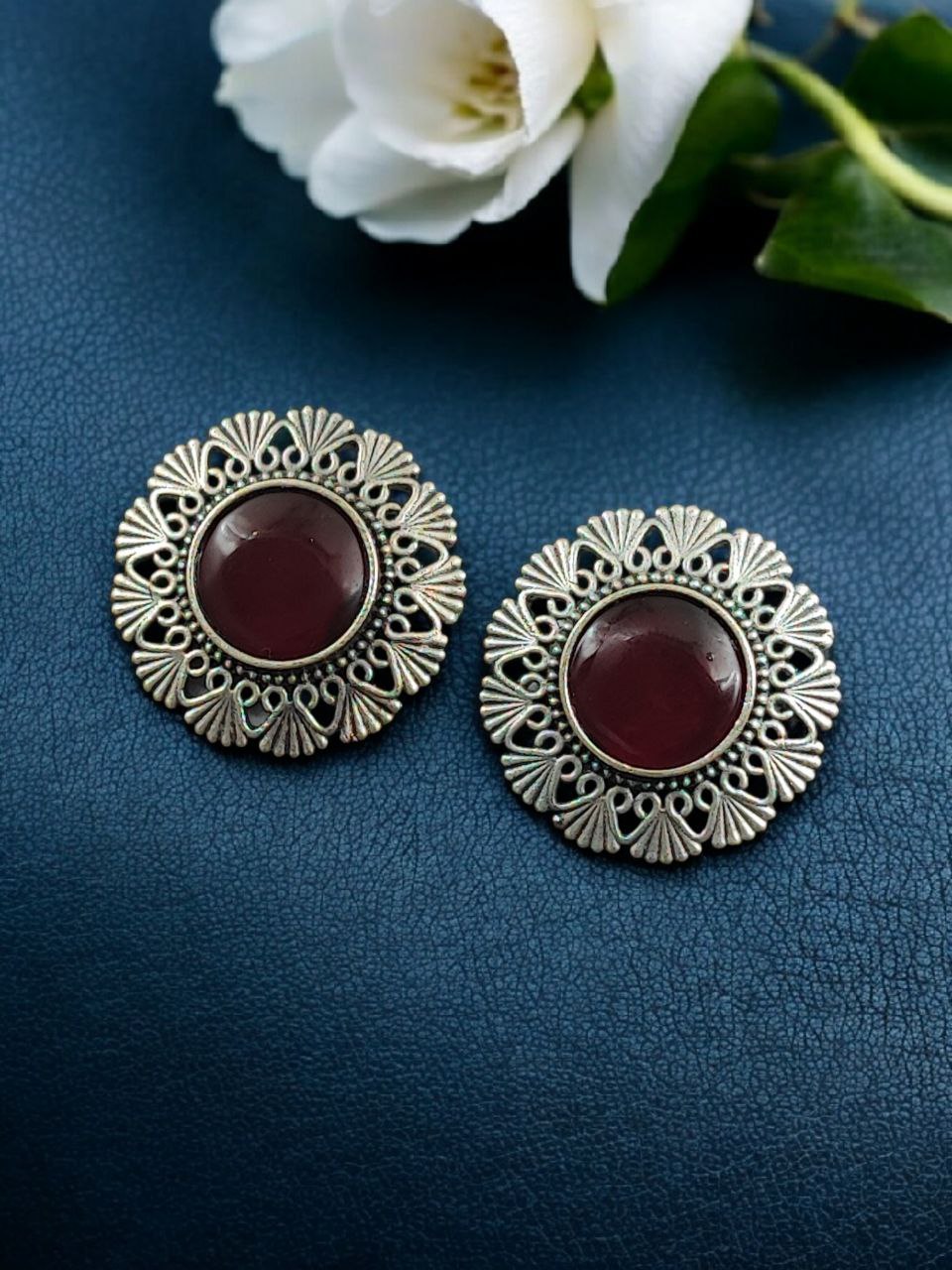 Antique Inspired Silver Replica Floral Art Statement Stud Earrings 9 Antique inspired silver replica floral art statement stud earrings with intricate carved detailing and oxidized finish for traditional and festive wear.