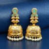 Gold plated floral art jhumka earrings with stone and pearl work