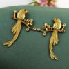 Gold plated parrot stud earrings with flower design and stone work