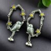 Oxidized silver replica parrot design dangler earrings with stone and pearl work