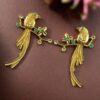Gold plated parrot stud earrings with flower design and stone work