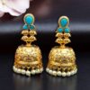 Gold plated floral art jhumka earrings with stone and pearl work
