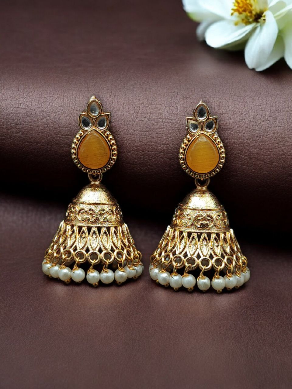 Luxurious Gold Plated Jhumka Earrings with Sparkling Stone Pearl Work 7 Luxurious gold plated jhumka earrings with sparkling stone embellishments and elegant pearl work, traditional Indian ethnic jewelry