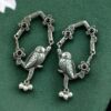 Oxidized silver replica parrot design dangler earrings with stone and pearl work