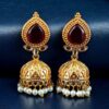 Gold plated jhumka earrings with stone and pearl work