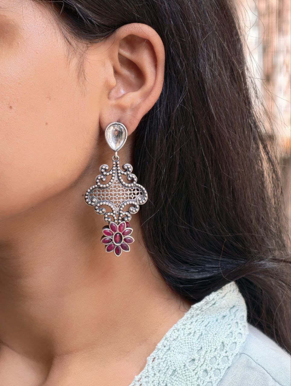 Stunning Silver Flower Dangler with Elegant Ethnic Appeal 1 Elegant Silver Flower Dangler with detailed floral design