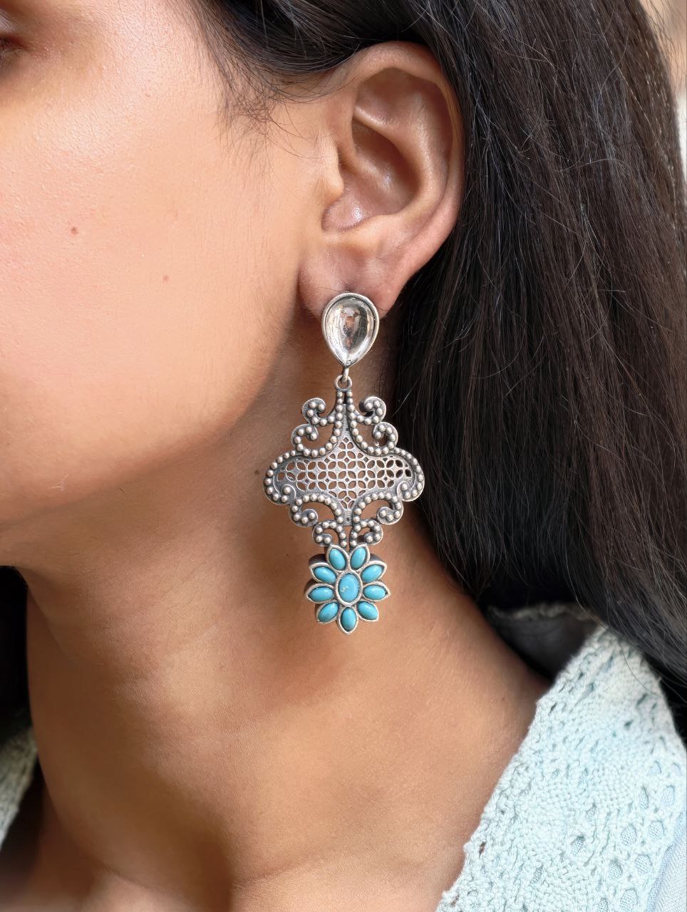 Stunning Silver Flower Dangler with Elegant Ethnic Appeal 3 Elegant Silver Flower Dangler with detailed floral design